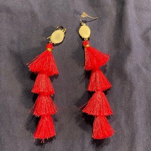 Great looking long pink earrings.